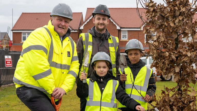 Three down, one thousand to go: school pupils help plant first trees at local development