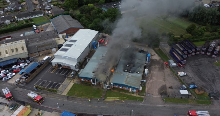 News story over 100 firefighters respond to two destructive industrial fires on same day