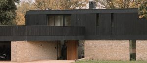 Heat-Treated and Charred Timber in Contemporary Architecture: Performance, Aesthetics and Regulatory Integration