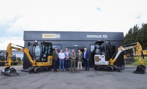Lucky winners of Finning giveaway collect excavator prizes