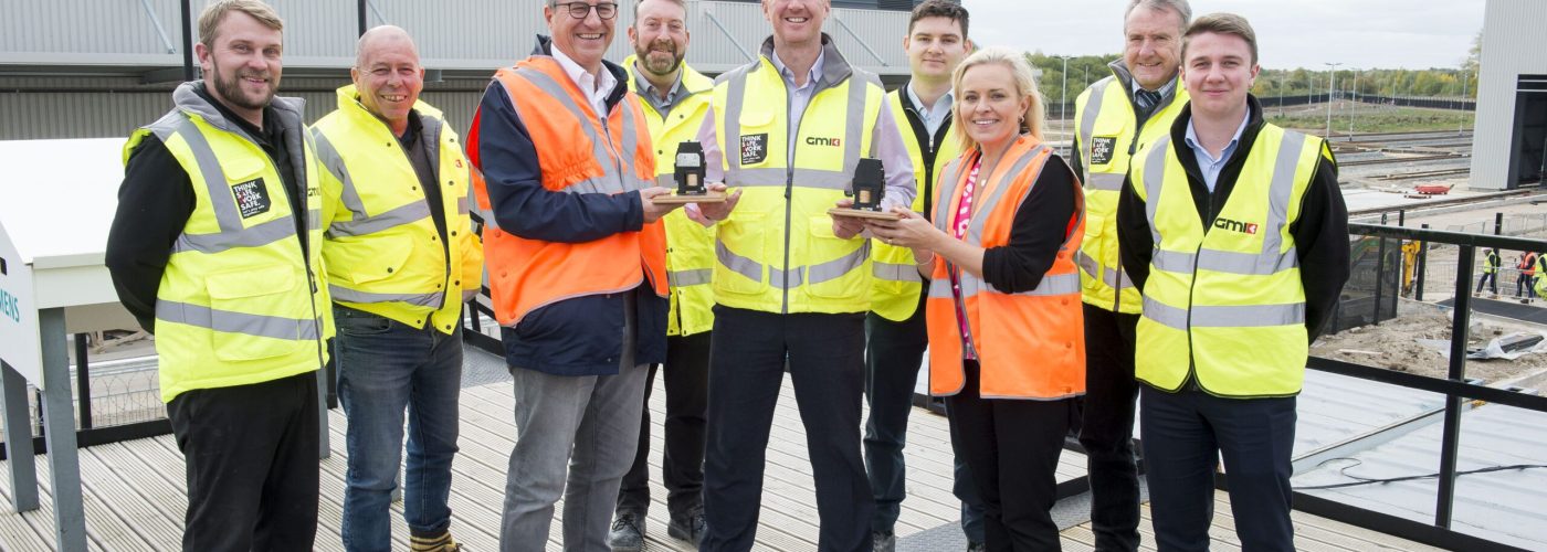 19 October 2022: Charlie Bagnall (Centre), Project Manager for GMI Construction Group, receives two safety awards from Siemens Mobility at their Goole site. Pictured handing over the awards are Oliver Mueller and Natalie Thornton of Siemens Mobilty. Also pictured are GMI site staff (l-r) Mitch Blockley, Simon Geddes, Steve Dwan, James Shaw, Mike Kershaw, Jack Sheard.
Picture: Sean Spencer/Hull News & Pictures Ltd
01482 210267/07976 433960
www.hullnews.co.uk         sean@hullnews.co.uk
