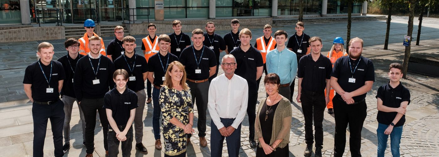 Charlie Spencer OBE, Executive Chairman and founder of Spencer Group, with Yvonne Moir, HR Director at Spencer Group, left, and Sarah Pashley, Principal of Ron Dearing UTC, with new Spencer Group apprentices and full-time employees.  Humber Quays, Kingston Upon Hull, East Yorkshire, United Kingdom, 06 September, 2021. Pictured: Spencer Group, apprentices.