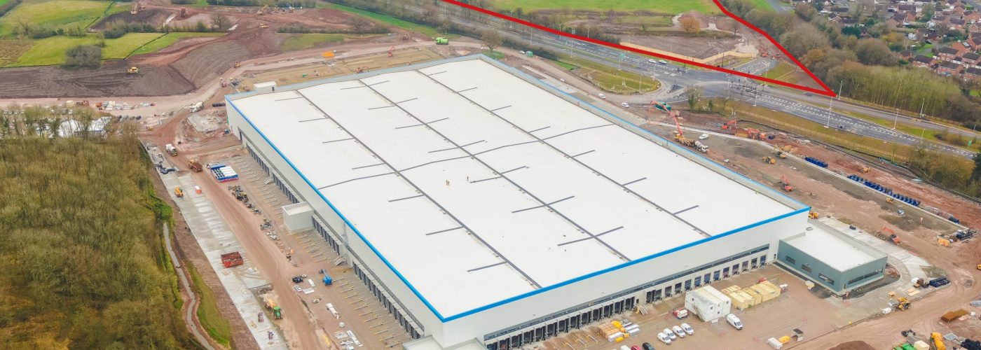 Aerial photograph of the Redditch Gateway development, including the new highways infrastructure; Unit A, a 366,000 sq ft warehouse building to the north of the site; and an additional plot of land with capacity for two additional build-to-suit units of between 150,000 sq ft – 250,000 sq ft.