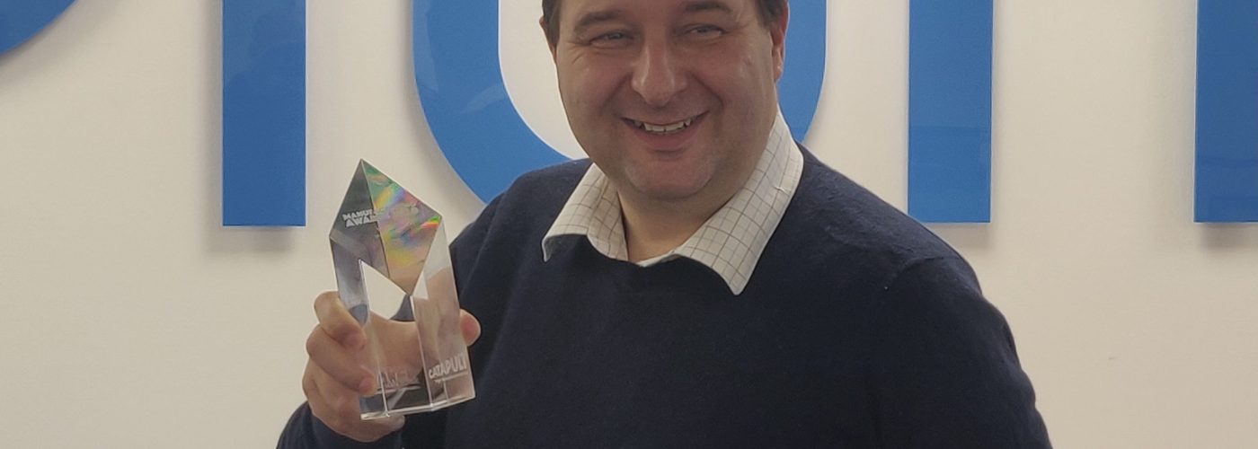 Will Goodwin business development manager at Plumis with Make UK trophy