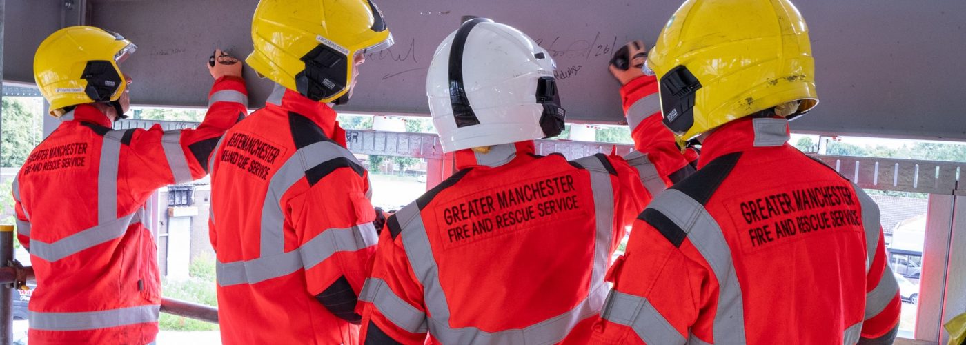 Beam-signing ceremony marks construction milestone for new community fire station in Blackley