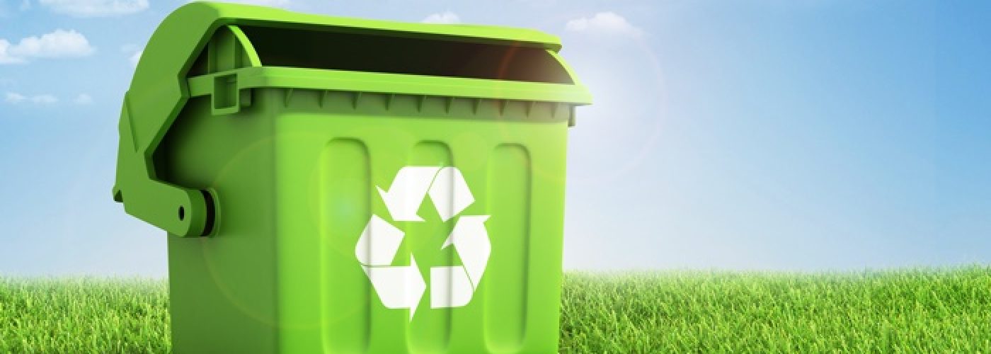 Green Plastic Trash Recycling Container Ecology Concept, With Landscape Background.